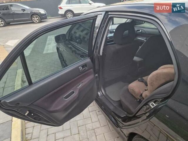 Чорний Міцубісі Lancer, об'ємом двигуна 2 л та пробігом 272 тис. км за 4750 $, фото 16 на Automoto.ua
