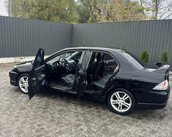 Чорний Міцубісі Lancer, об'ємом двигуна 2 л та пробігом 210 тис. км за 5500 $, фото 14 на Automoto.ua