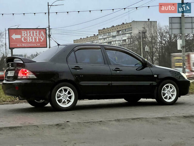 Чорний Міцубісі Lancer, об'ємом двигуна 1.6 л та пробігом 303 тис. км за 4350 $, фото 4 на Automoto.ua