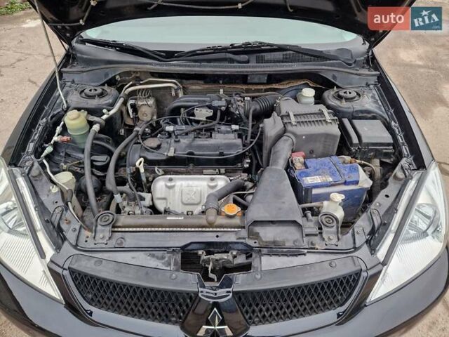 Чорний Міцубісі Lancer, об'ємом двигуна 1.6 л та пробігом 273 тис. км за 3999 $, фото 22 на Automoto.ua