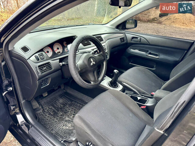 Черный Мицубиси Лансер, объемом двигателя 1.6 л и пробегом 216 тыс. км за 4990 $, фото 10 на Automoto.ua