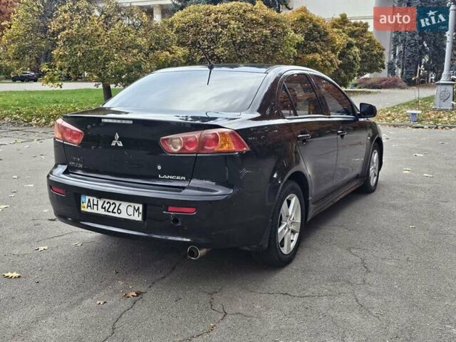 Міцубісі Lancer 2007 у Києві на Automoto.ua Чорний Міцубісі Lancer, об'ємом двигуна 2 л та пробігом 115 тис. км за 5000 $, фото 4 на Automoto.ua