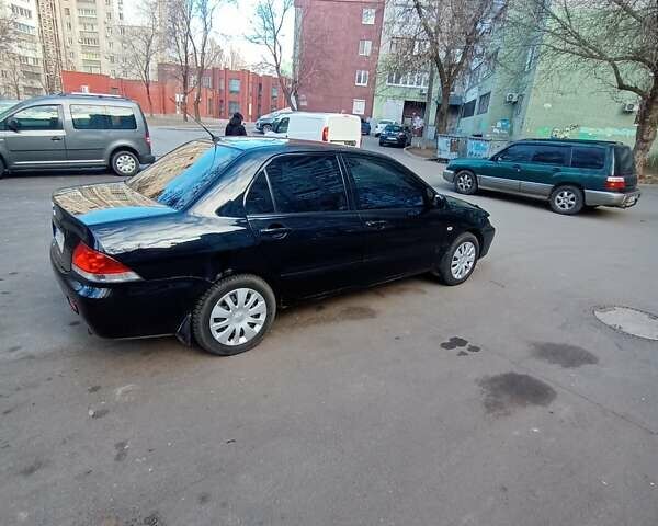 Чорний Міцубісі Lancer, об'ємом двигуна 1.6 л та пробігом 296 тис. км за 4500 $, фото 5 на Automoto.ua