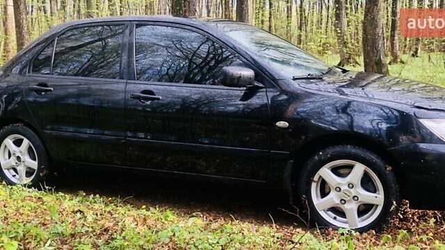 Чорний Міцубісі Lancer, об'ємом двигуна 1.6 л та пробігом 326 тис. км за 3100 $, фото 6 на Automoto.ua