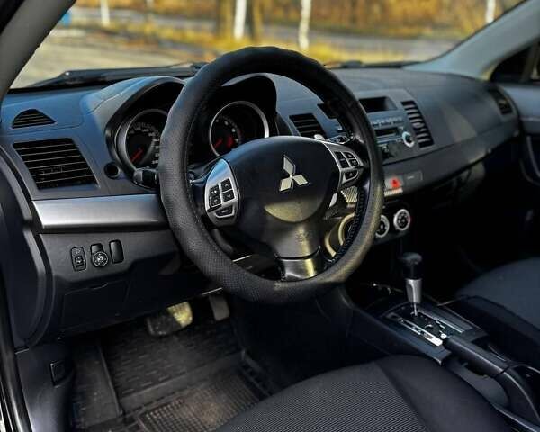 Черный Мицубиси Лансер, объемом двигателя 2 л и пробегом 224 тыс. км за 7000 $, фото 3 на Automoto.ua