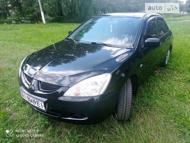 Чорний Міцубісі Lancer, об'ємом двигуна 1.58 л та пробігом 400 тис. км за 3700 $, фото 28 на Automoto.ua