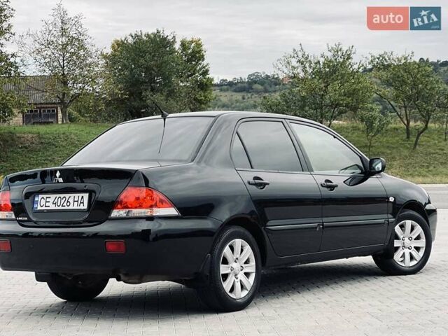 Чорний Міцубісі Lancer, об'ємом двигуна 1.6 л та пробігом 243 тис. км за 4950 $, фото 23 на Automoto.ua
