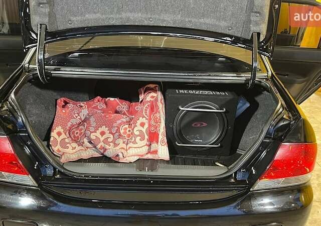 Черный Мицубиси Лансер, объемом двигателя 1.6 л и пробегом 249 тыс. км за 5000 $, фото 19 на Automoto.ua