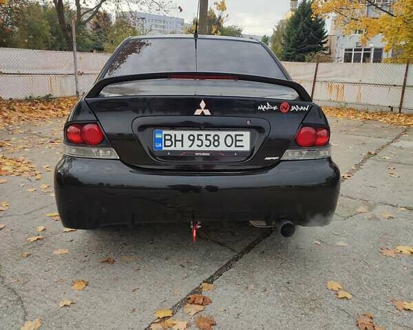 Мицубиси Лансер 2007 в Южноукраинске на Automoto.ua Черный Мицубиси Лансер, объемом двигателя 2 л и пробегом 161 тыс. км за 4600 $, фото 5 на Automoto.ua