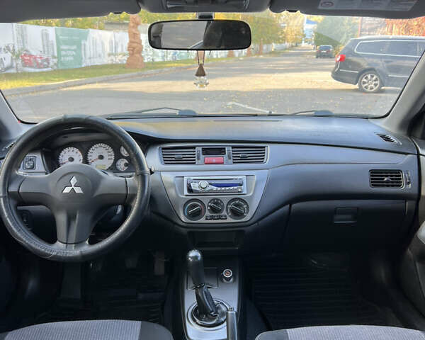 Чорний Міцубісі Lancer, об'ємом двигуна 1.58 л та пробігом 175 тис. км за 5200 $, фото 6 на Automoto.ua