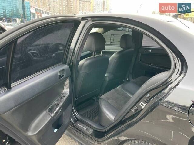 Черный Мицубиси Лансер, объемом двигателя 2 л и пробегом 246 тыс. км за 7500 $, фото 19 на Automoto.ua