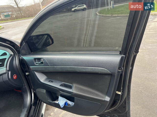 Черный Мицубиси Лансер, объемом двигателя 2 л и пробегом 350 тыс. км за 6700 $, фото 15 на Automoto.ua