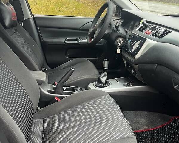 Черный Мицубиси Лансер, объемом двигателя 1.6 л и пробегом 272 тыс. км за 2800 $, фото 12 на Automoto.ua