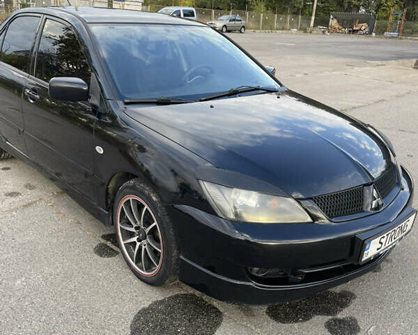 Чорний Міцубісі Lancer, об'ємом двигуна 2 л та пробігом 280 тис. км за 4600 $, фото 3 на Automoto.ua