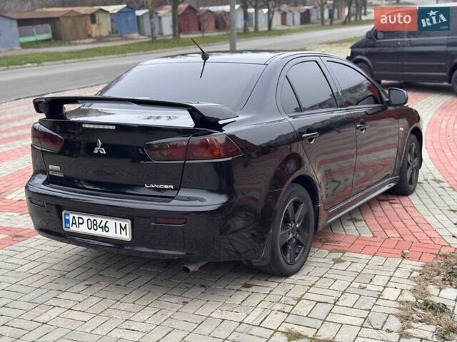 Черный Мицубиси Лансер, объемом двигателя 2 л и пробегом 217 тыс. км за 5500 $, фото 7 на Automoto.ua