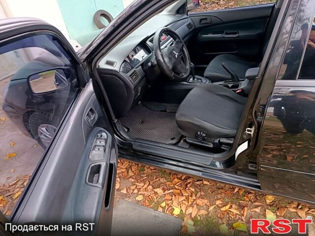 Чорний Міцубісі Lancer, об'ємом двигуна 1.6 л та пробігом 227 тис. км за 4100 $, фото 8 на Automoto.ua
