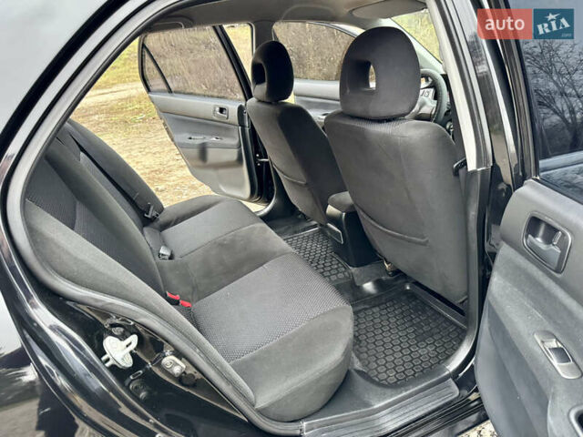 Черный Мицубиси Лансер, объемом двигателя 1.6 л и пробегом 216 тыс. км за 4990 $, фото 15 на Automoto.ua