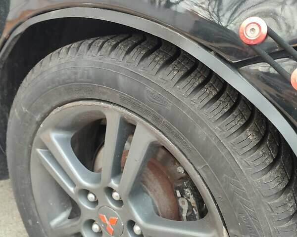 Мицубиси Лансер 2007 в Южноукраинске на Automoto.ua Черный Мицубиси Лансер, объемом двигателя 2 л и пробегом 161 тыс. км за 4600 $, фото 18 на Automoto.ua