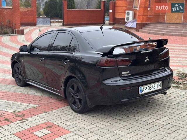 Черный Мицубиси Лансер, объемом двигателя 2 л и пробегом 217 тыс. км за 5500 $, фото 5 на Automoto.ua