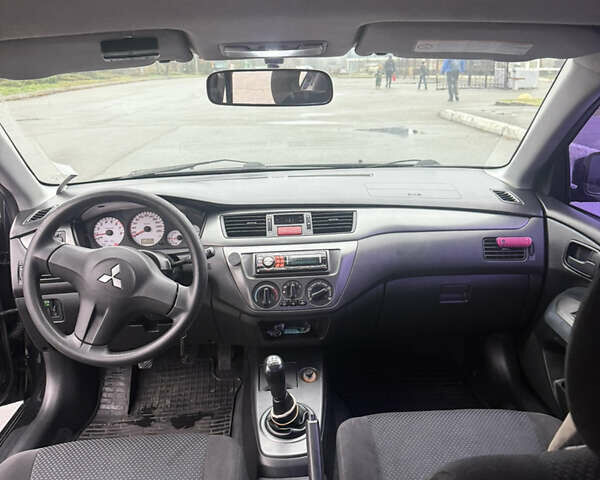 Чорний Міцубісі Lancer, об'ємом двигуна 1.58 л та пробігом 256 тис. км за 3700 $, фото 18 на Automoto.ua