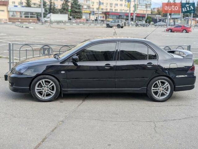 Чорний Міцубісі Lancer, об'ємом двигуна 2 л та пробігом 152 тис. км за 5500 $, фото 30 на Automoto.ua
