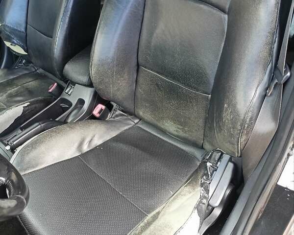 Черный Мицубиси Лансер, объемом двигателя 2 л и пробегом 280 тыс. км за 5700 $, фото 12 на Automoto.ua