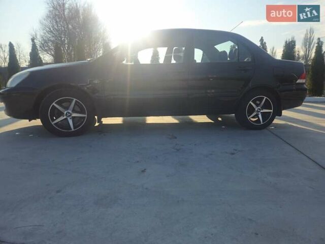 Чорний Міцубісі Lancer, об'ємом двигуна 1.59 л та пробігом 180 тис. км за 4999 $, фото 7 на Automoto.ua
