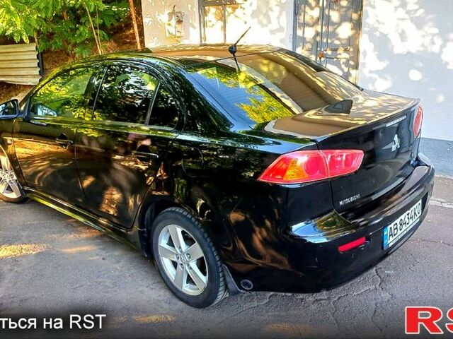 Черный Мицубиси Лансер, объемом двигателя 2 л и пробегом 290 тыс. км за 5800 $, фото 6 на Automoto.ua