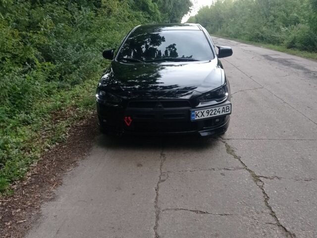 Черный Мицубиси Лансер, объемом двигателя 2 л и пробегом 245 тыс. км за 7500 $, фото 3 на Automoto.ua