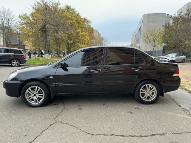 Черный Мицубиси Лансер, объемом двигателя 1.6 л и пробегом 173 тыс. км за 4700 $, фото 1 на Automoto.ua