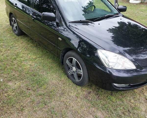 Черный Мицубиси Лансер, объемом двигателя 1.6 л и пробегом 210 тыс. км за 5500 $, фото 4 на Automoto.ua