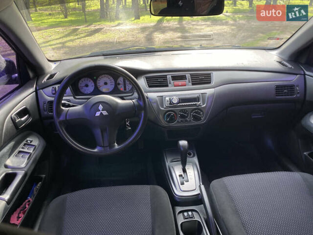 Чорний Міцубісі Lancer, об'ємом двигуна 1.6 л та пробігом 224 тис. км за 4950 $, фото 19 на Automoto.ua
