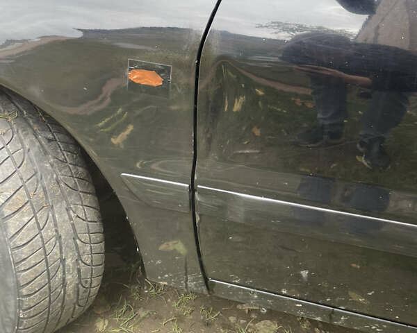 Черный Мицубиси Лансер, объемом двигателя 1.6 л и пробегом 258 тыс. км за 2999 $, фото 6 на Automoto.ua