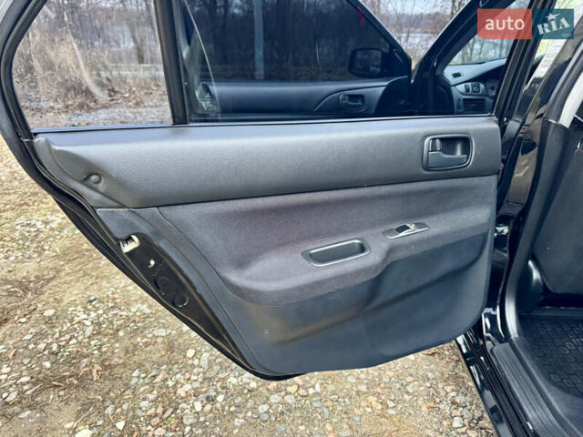 Черный Мицубиси Лансер, объемом двигателя 1.6 л и пробегом 216 тыс. км за 4990 $, фото 14 на Automoto.ua