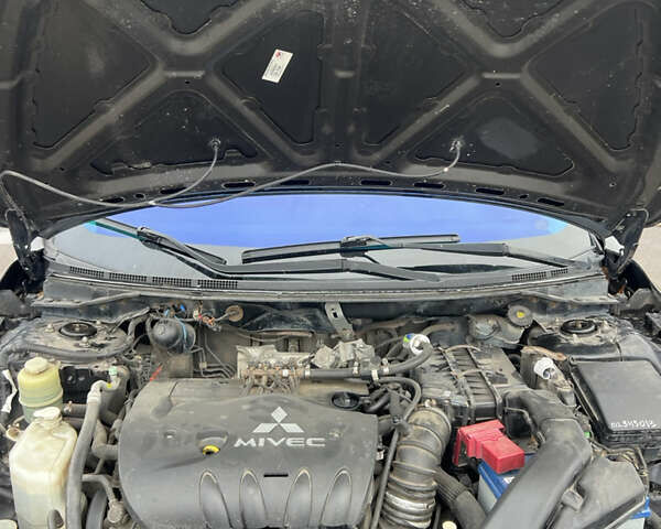 Черный Мицубиси Лансер, объемом двигателя 2 л и пробегом 350 тыс. км за 6700 $, фото 11 на Automoto.ua