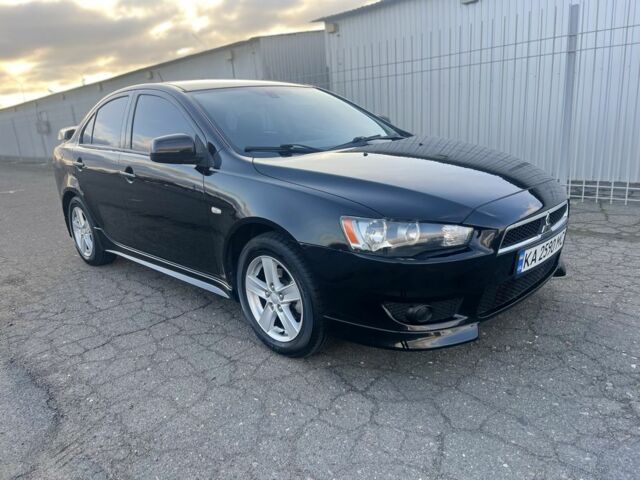 Черный Мицубиси Лансер, объемом двигателя 2 л и пробегом 170 тыс. км за 7900 $, фото 1 на Automoto.ua