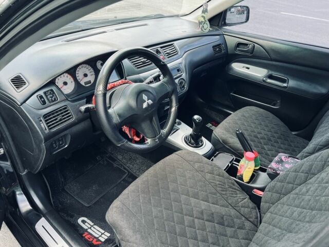 Чорний Міцубісі Lancer, об'ємом двигуна 1.6 л та пробігом 228 тис. км за 3600 $, фото 8 на Automoto.ua