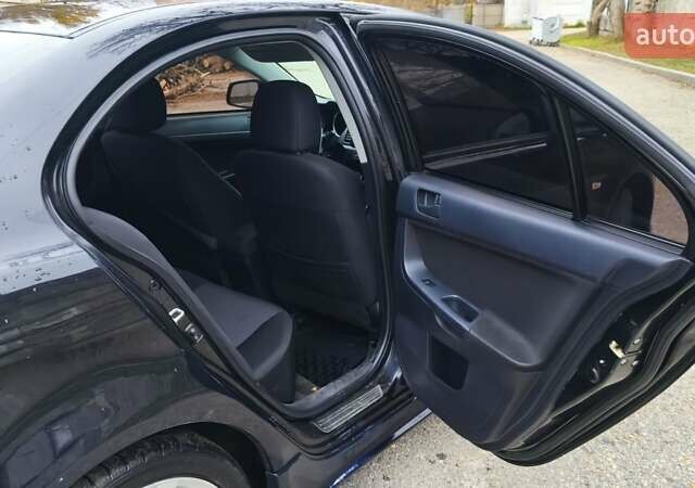 Черный Мицубиси Лансер, объемом двигателя 2 л и пробегом 230 тыс. км за 7100 $, фото 1 на Automoto.ua