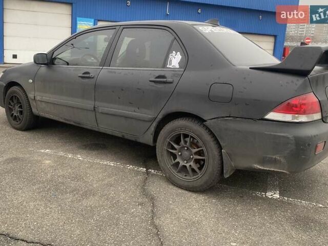 Черный Мицубиси Лансер, объемом двигателя 1.58 л и пробегом 263 тыс. км за 4000 $, фото 16 на Automoto.ua