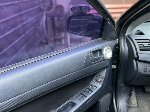 Чорний Міцубісі Lancer, об'ємом двигуна 2 л та пробігом 175 тис. км за 6500 $, фото 10 на Automoto.ua