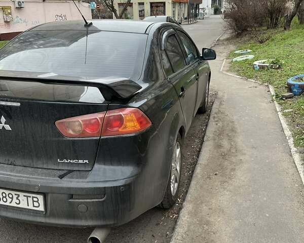 Черный Мицубиси Лансер, объемом двигателя 2 л и пробегом 220 тыс. км за 5500 $, фото 4 на Automoto.ua