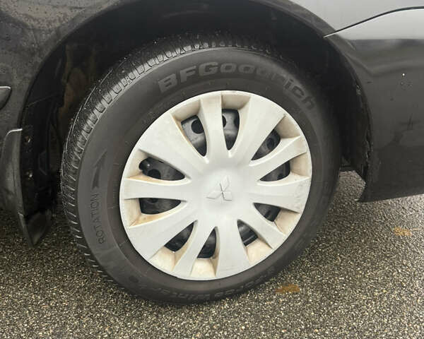 Чорний Міцубісі Lancer, об'ємом двигуна 1.58 л та пробігом 256 тис. км за 3700 $, фото 28 на Automoto.ua