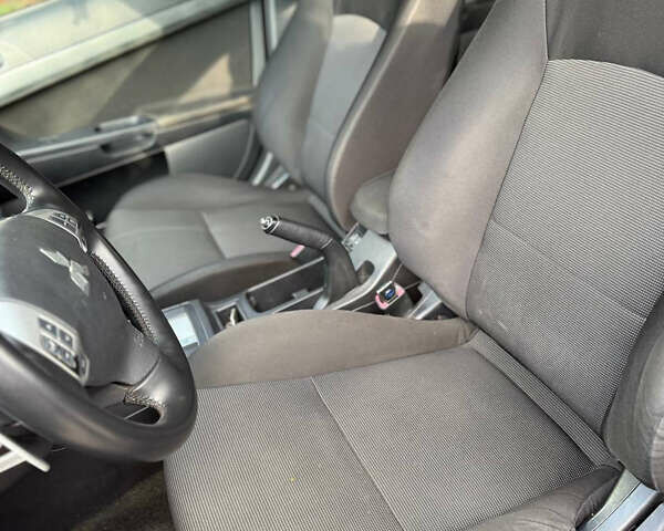 Черный Мицубиси Лансер, объемом двигателя 2 л и пробегом 219 тыс. км за 6400 $, фото 14 на Automoto.ua