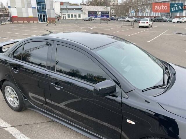 Черный Мицубиси Лансер, объемом двигателя 2 л и пробегом 246 тыс. км за 7500 $, фото 10 на Automoto.ua