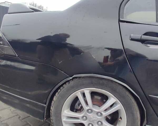 Чорний Міцубісі Lancer, об'ємом двигуна 2 л та пробігом 145 тис. км за 5000 $, фото 1 на Automoto.ua