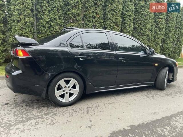 Чорний Міцубісі Lancer, об'ємом двигуна 2 л та пробігом 69 тис. км за 6200 $, фото 7 на Automoto.ua