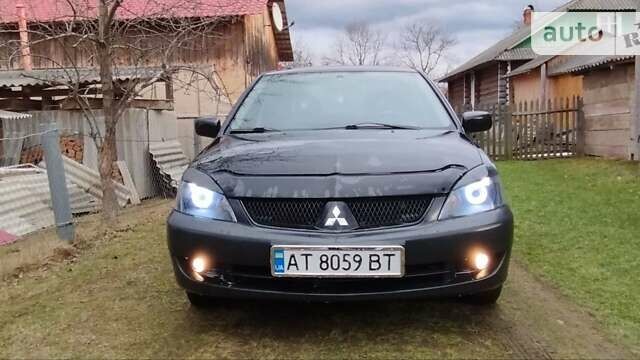 Чорний Міцубісі Lancer, об'ємом двигуна 1.58 л та пробігом 175 тис. км за 4200 $, фото 9 на Automoto.ua