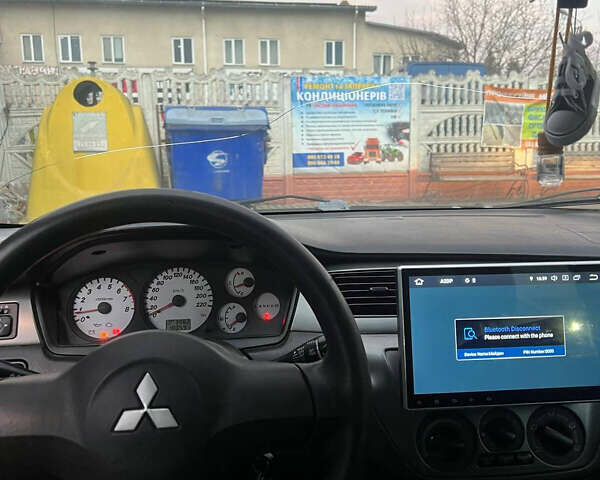 Черный Мицубиси Лансер, объемом двигателя 1.6 л и пробегом 180 тыс. км за 3499 $, фото 16 на Automoto.ua