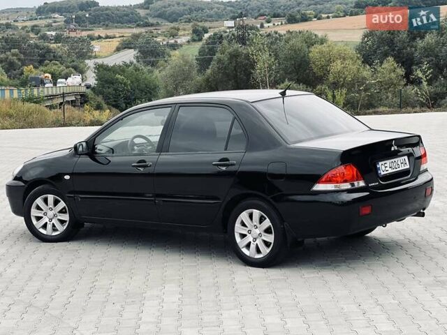 Чорний Міцубісі Lancer, об'ємом двигуна 1.6 л та пробігом 243 тис. км за 4950 $, фото 27 на Automoto.ua