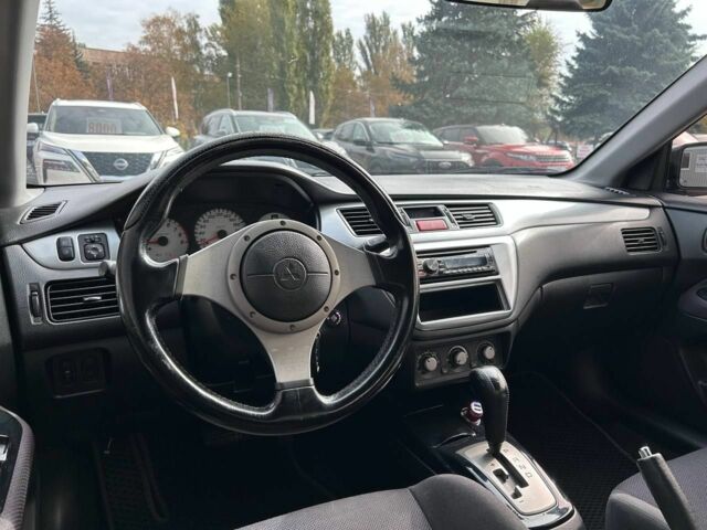 Мицубиси Лансер 2007 в Кривом Роге на Automoto.ua Черный Мицубиси Лансер, объемом двигателя 2 л и пробегом 143 тыс. км за 5400 $, фото 16 на Automoto.ua